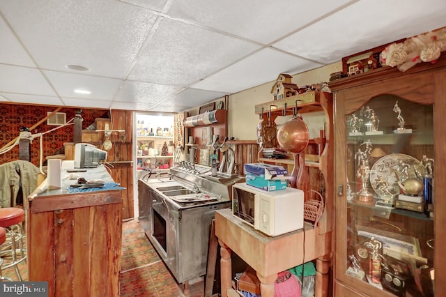 home office featuring sink and a drop ceiling