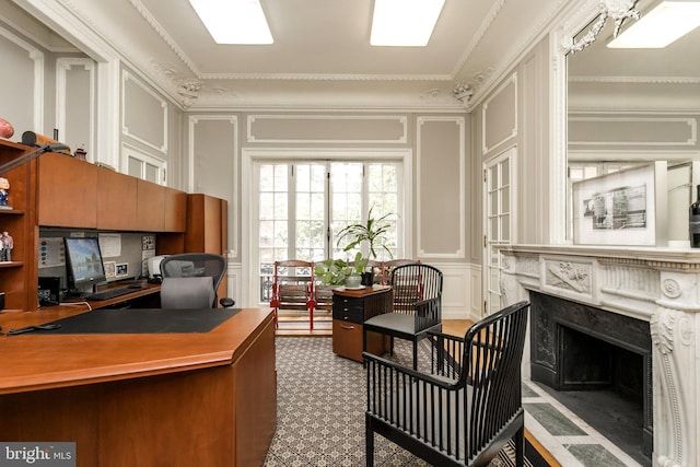 office space featuring a high end fireplace and crown molding