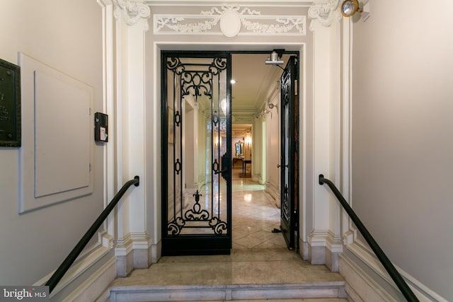 interior space with crown molding