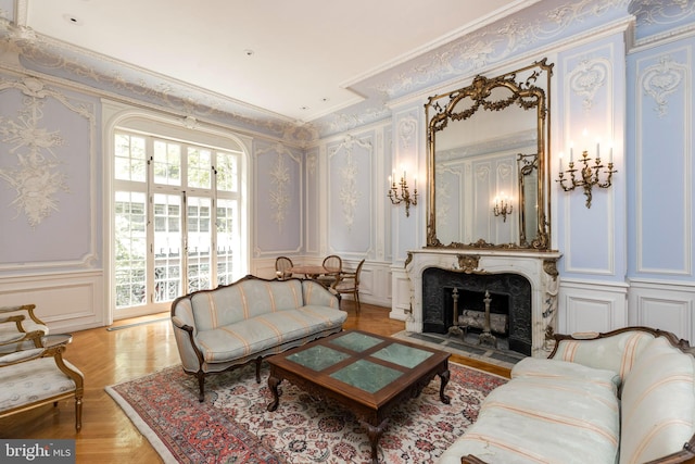 living room featuring ornamental molding and a fireplace