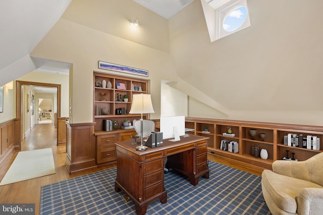 office space featuring dark hardwood / wood-style flooring and vaulted ceiling