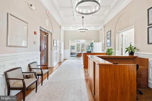 reception area featuring french doors and a notable chandelier