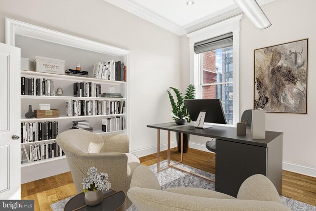 office space featuring ornamental molding and light wood-type flooring