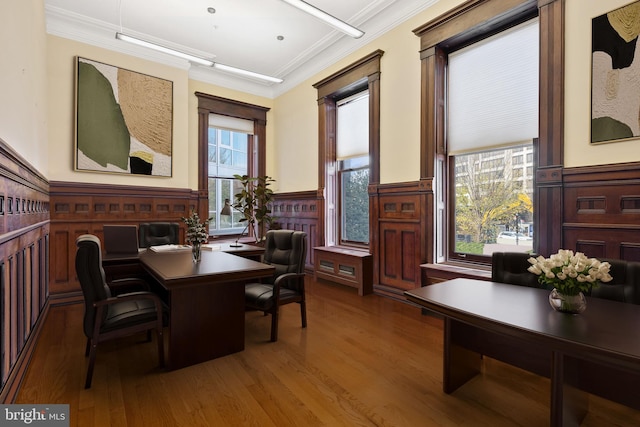 dining room with dark hardwood / wood-style floors and crown molding