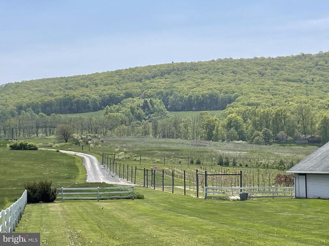 birds eye view of property featuring a rural view