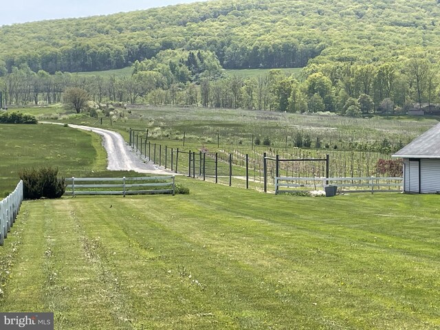 birds eye view of property with a rural view