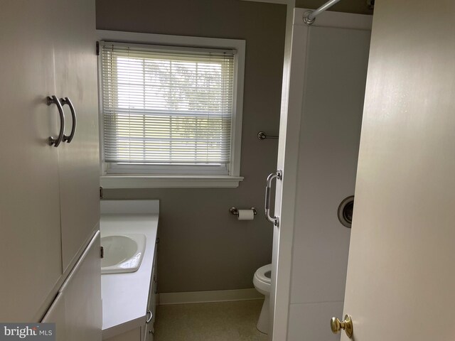 bathroom with toilet and vanity