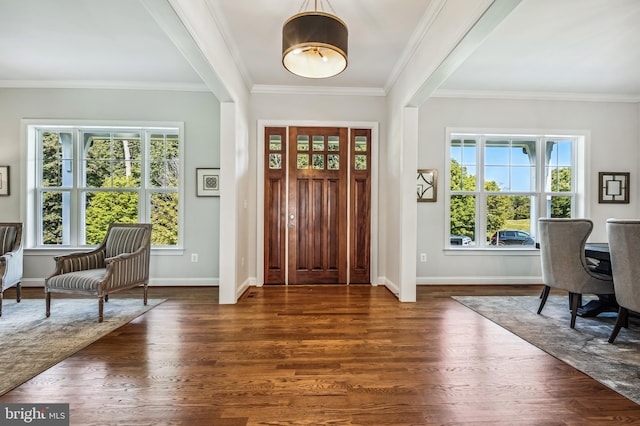 entrance foyer with dark wood-type flooring and crown molding