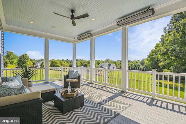 sunroom / solarium with ceiling fan and a wealth of natural light