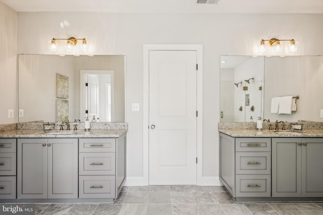 bathroom featuring tile flooring and dual bowl vanity