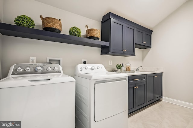 laundry room with independent washer and dryer, sink, electric dryer hookup, light tile flooring, and cabinets