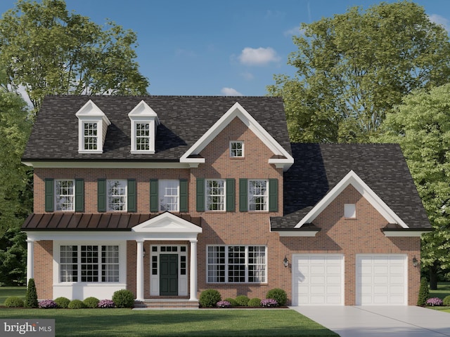 view of front of house featuring a front lawn and a garage