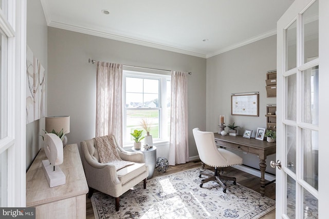 office space with ornamental molding, french doors, and light hardwood / wood-style flooring