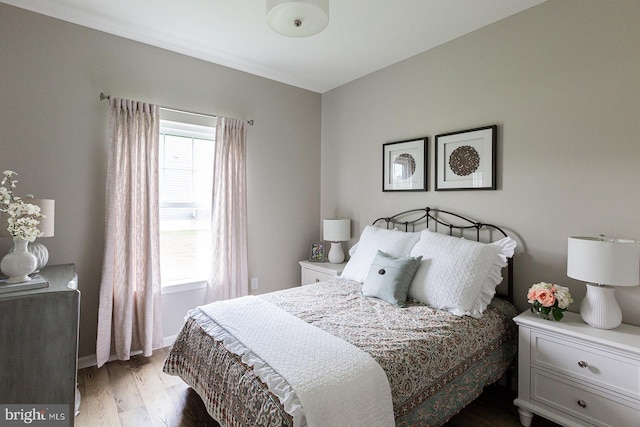 bedroom featuring dark hardwood / wood-style floors