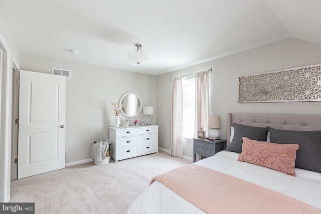 carpeted bedroom featuring lofted ceiling