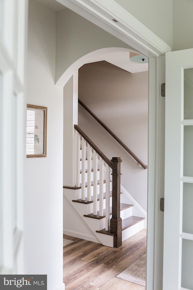 stairway featuring light hardwood / wood-style flooring