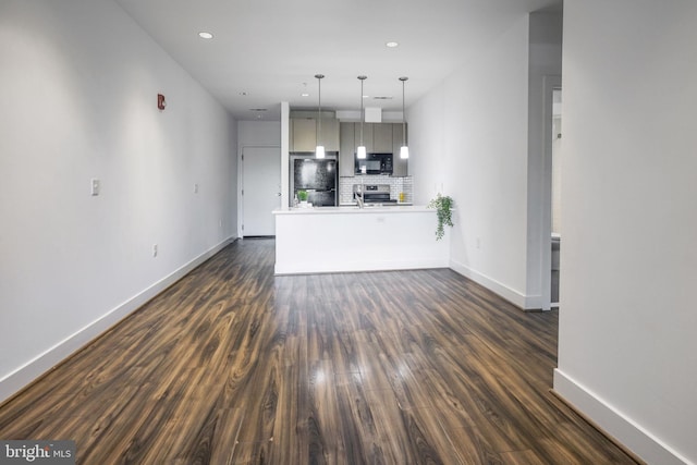 unfurnished living room with dark hardwood / wood-style floors