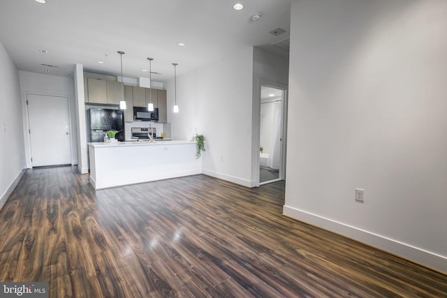 kitchen with dark hardwood / wood-style flooring, tasteful backsplash, black appliances, and decorative light fixtures