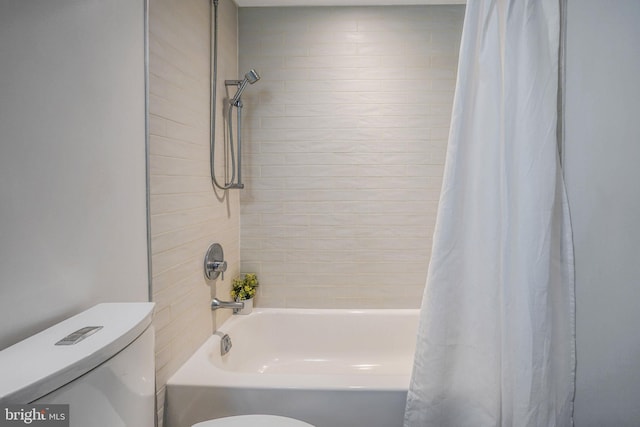 bathroom featuring shower / bath combo and toilet