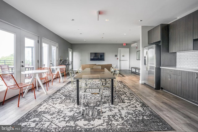 interior space with french doors and light hardwood / wood-style floors