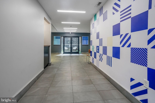 corridor with light tile flooring