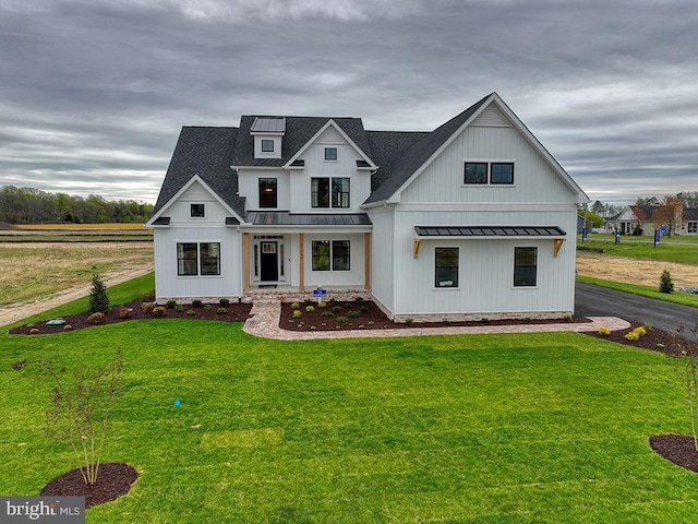 modern farmhouse with a front yard