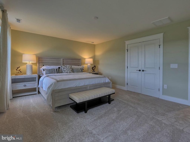 bedroom with light carpet