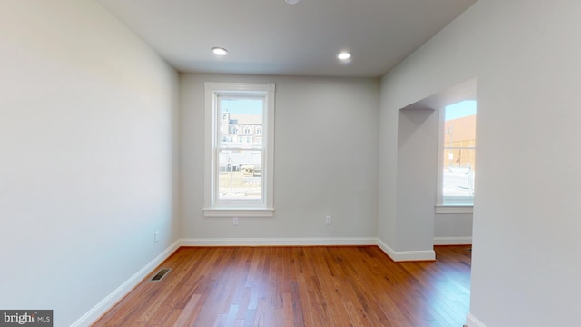 empty room with light hardwood / wood-style floors