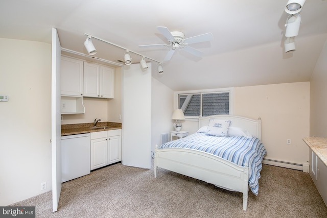 carpeted bedroom featuring ceiling fan, sink, vaulted ceiling, and a baseboard heating unit