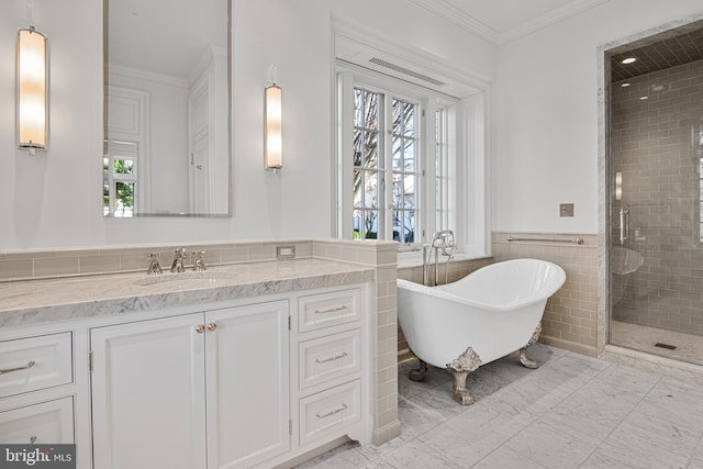 bathroom with vanity, separate shower and tub, ornamental molding, and a wealth of natural light