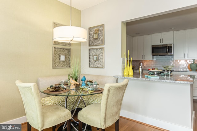 dining room featuring dark wood-type flooring