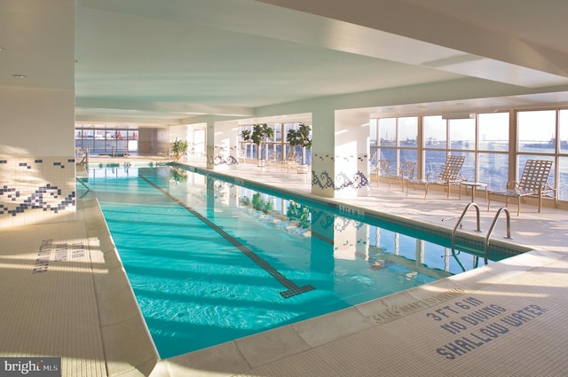 view of pool with a water view