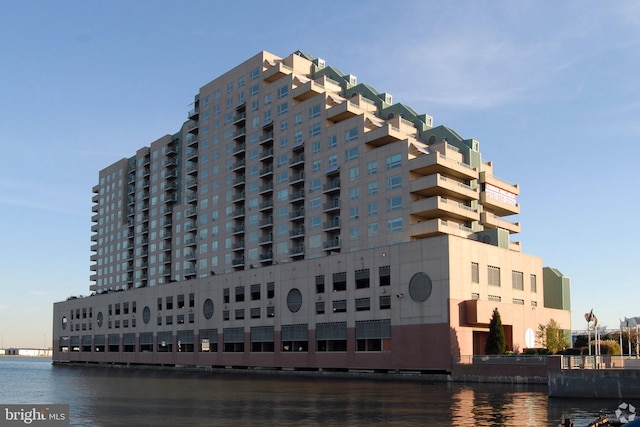 view of building exterior with a water view