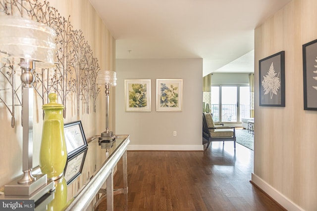 hallway with dark hardwood / wood-style flooring