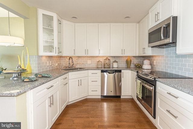 kitchen featuring white cabinets, stainless steel appliances, and sink