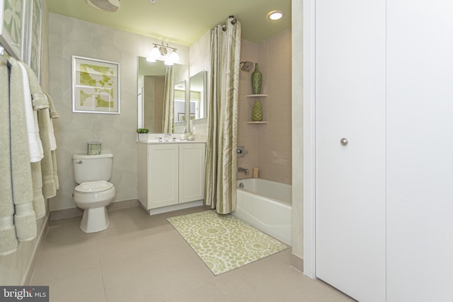 full bathroom featuring tile patterned floors, vanity, toilet, and shower / tub combo with curtain