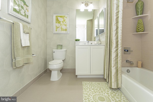 full bathroom featuring tile patterned floors, vanity, toilet, and shower / bath combo with shower curtain