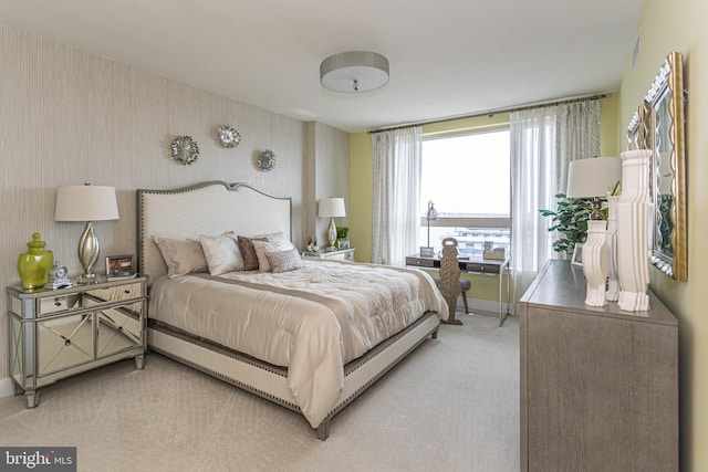 bedroom with light colored carpet