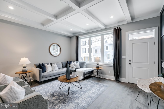 living room featuring beamed ceiling, coffered ceiling, and hardwood / wood-style floors