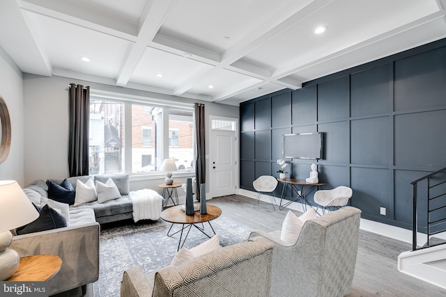 living room featuring coffered ceiling, beam ceiling, and hardwood / wood-style floors