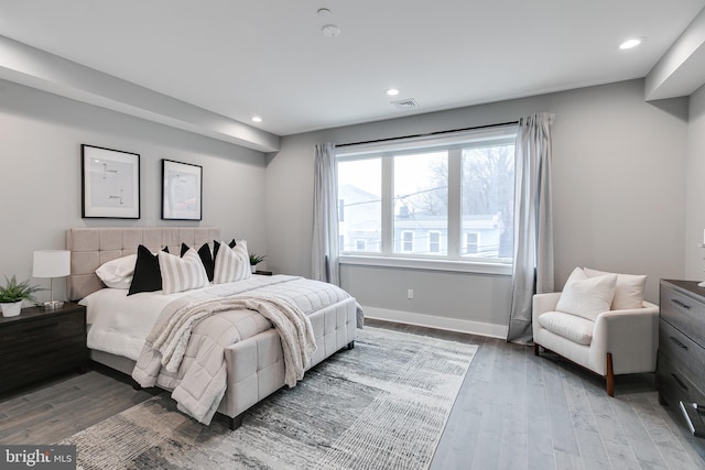 bedroom with hardwood / wood-style floors