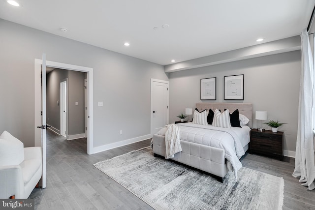 bedroom with hardwood / wood-style floors