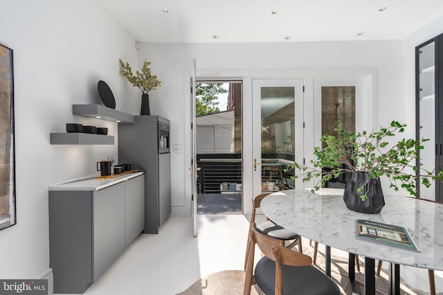 tiled dining space with french doors