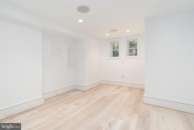 spare room with light hardwood / wood-style floors