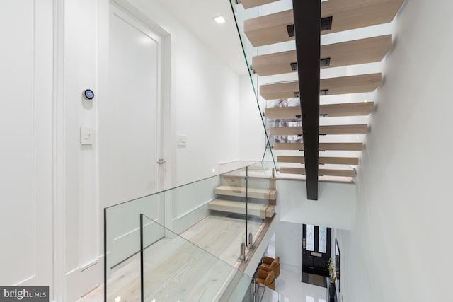 stairs featuring light tile floors