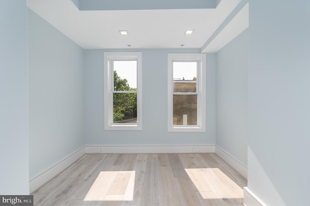 spare room featuring light hardwood / wood-style floors