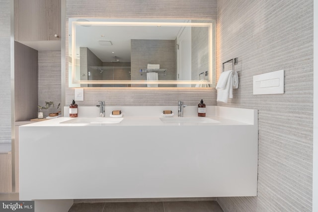 bathroom featuring radiator heating unit, double vanity, and tile floors