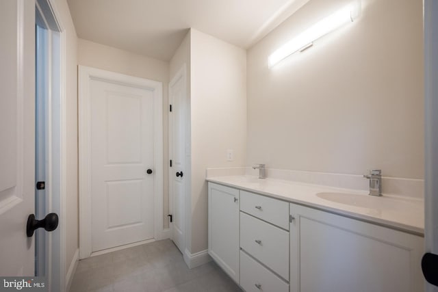 bathroom with dual bowl vanity and tile floors