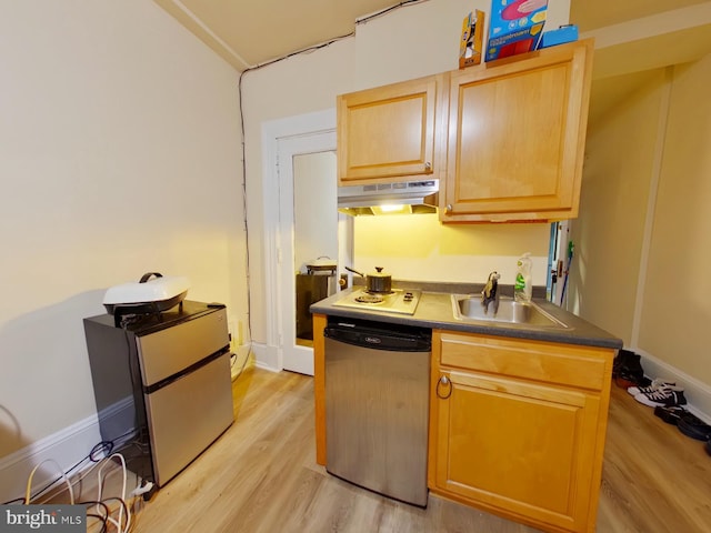 kitchen featuring appliances with stainless steel finishes, light hardwood / wood-style flooring, sink, and light brown cabinets