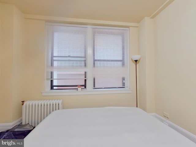 bedroom with radiator heating unit